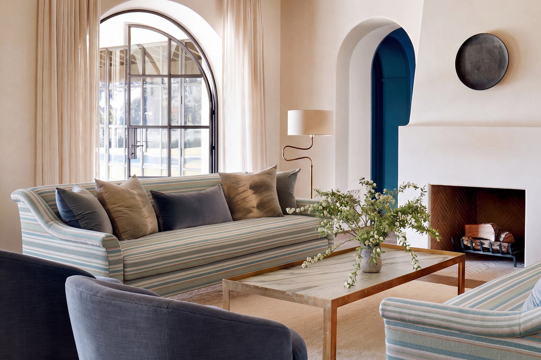 A sofa in a Brentwood home designed by Kathryn M. Ireland featuring sofas in Berwick Stripe - Multi