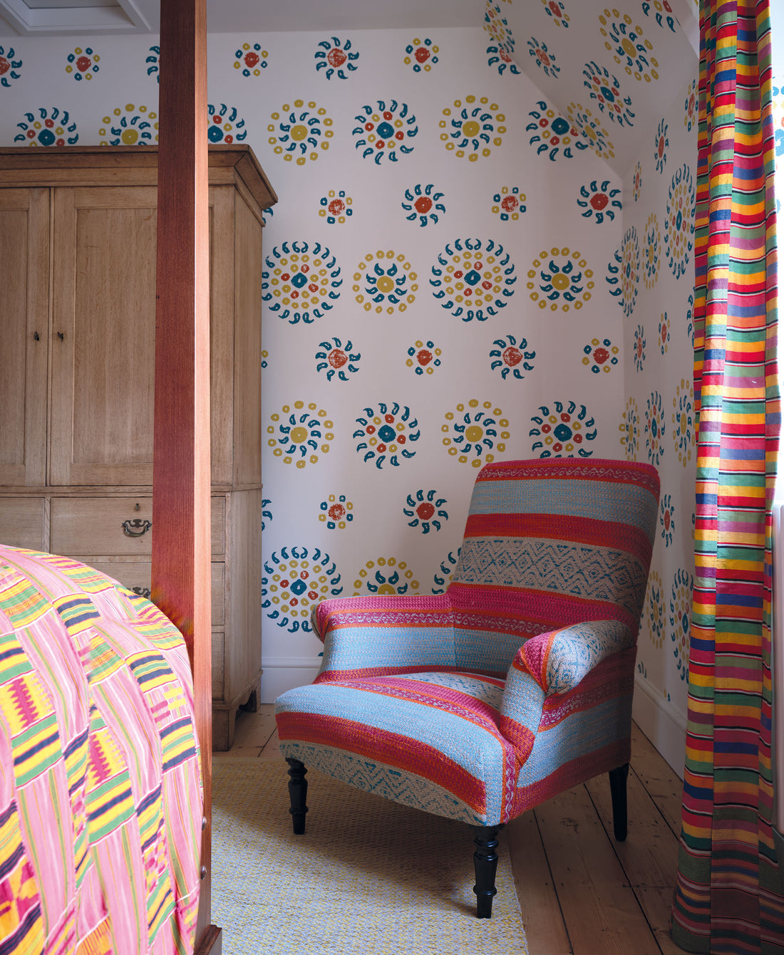 A bedroom in a Cotswolds home designed by Kathryn M. Ireland featuring Natural Marrakech wallpaper in Teal