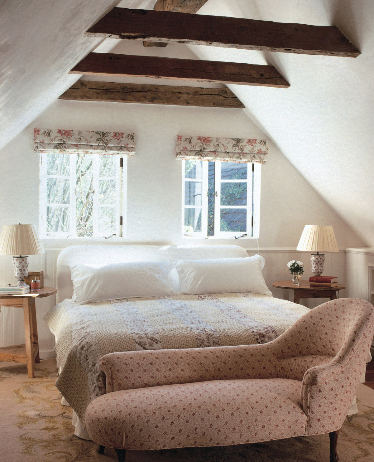 A bedroom featuring a chaise lounge in Floral red designed by Kathryn M. Ireland