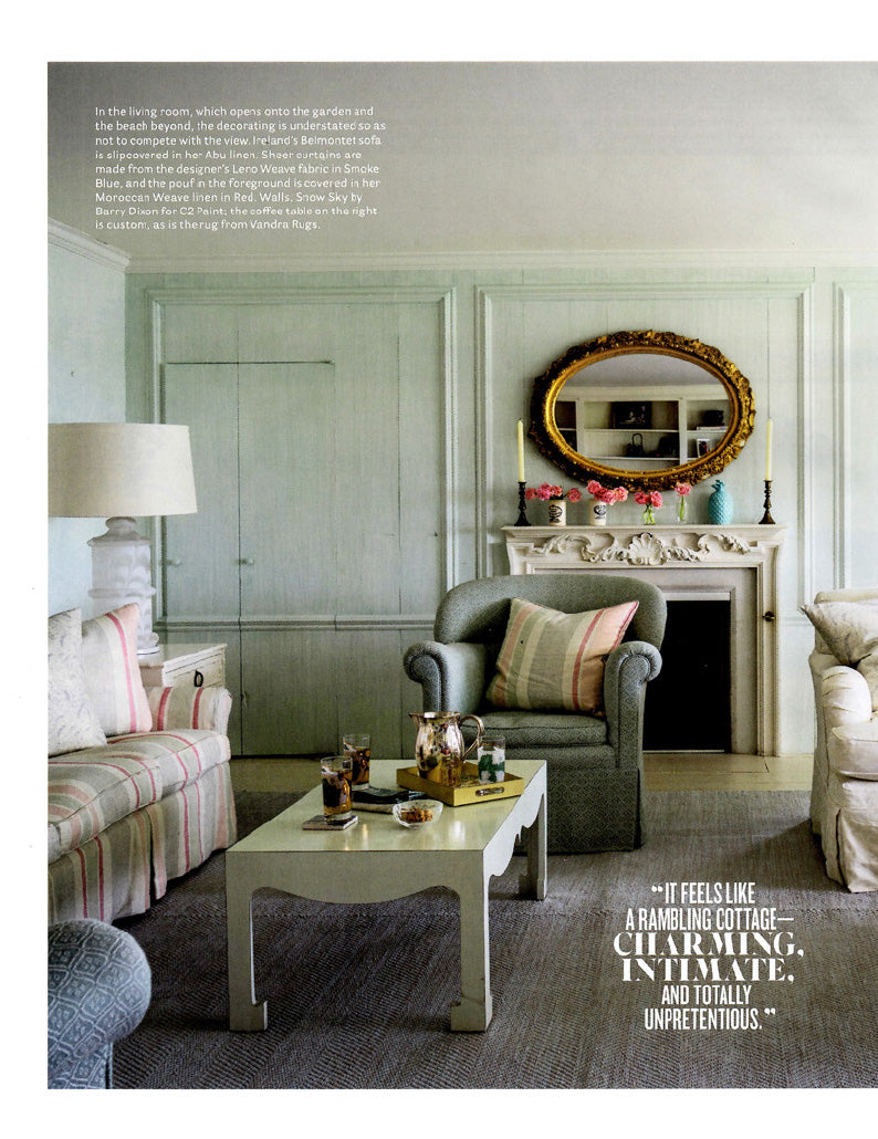 A page in House Beautiful magazine featuring a living room in a Cape Cod home designed by Kathryn M. Ireland