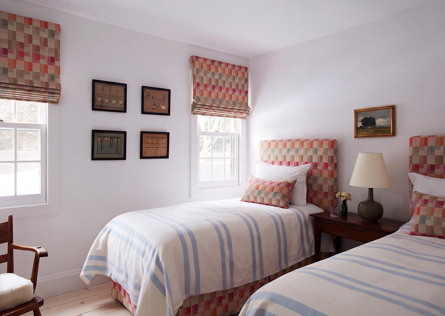 A bedroom featuring Kinross Multi headboards, bed curtains, pillows, and window shades by Kathryn M. Ireland