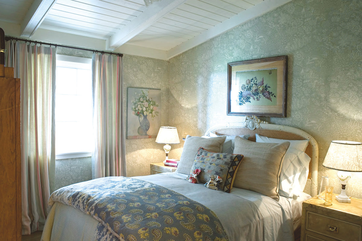 A bedroom with Quilt Indigo bed spread and Moroccan Weave Natural pillows designed by Kathryn M. Ireland.