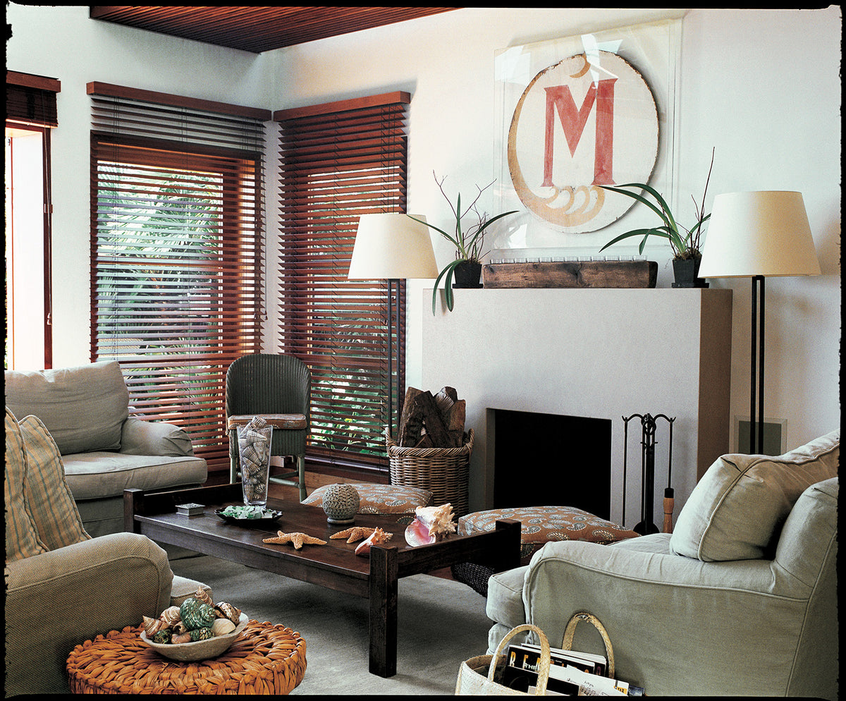 A living room with Quilt Pug ottomans designed by Kathryn M. Ireland