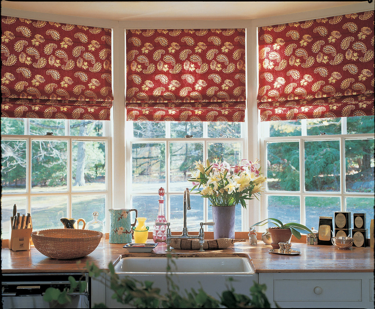 Three Quilt Red Roman window valances above a kitchen window designed by Kathryn M. Ireland