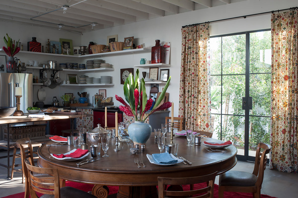 The back workshop of a Santa Monica home designed by Kathryn M. Ireland featuring Safi Suzani - Chocolate Cherry curtains