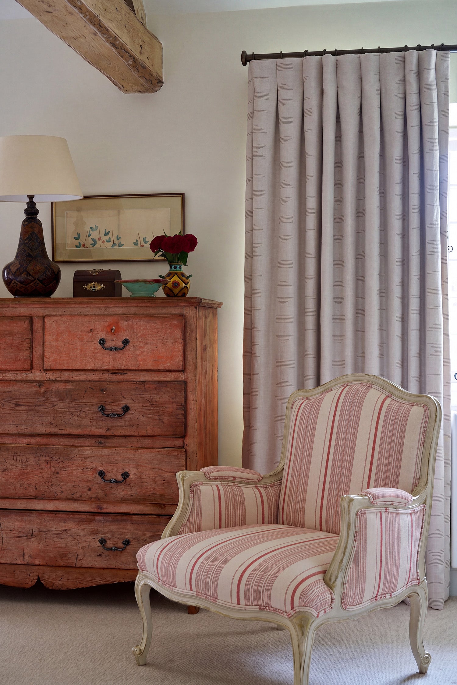 A tufted arm chair in Vicenza Stripe Regal by Kathryn M. Ireland